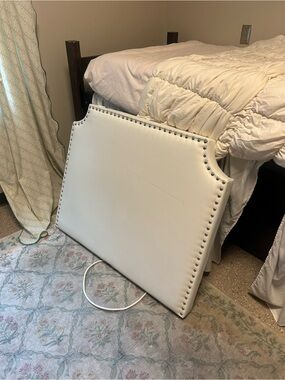 White Upholstered Headboard with Silver Nailhead Trim